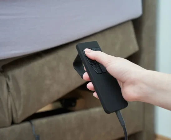 Hand holding remote for adjustable bed base