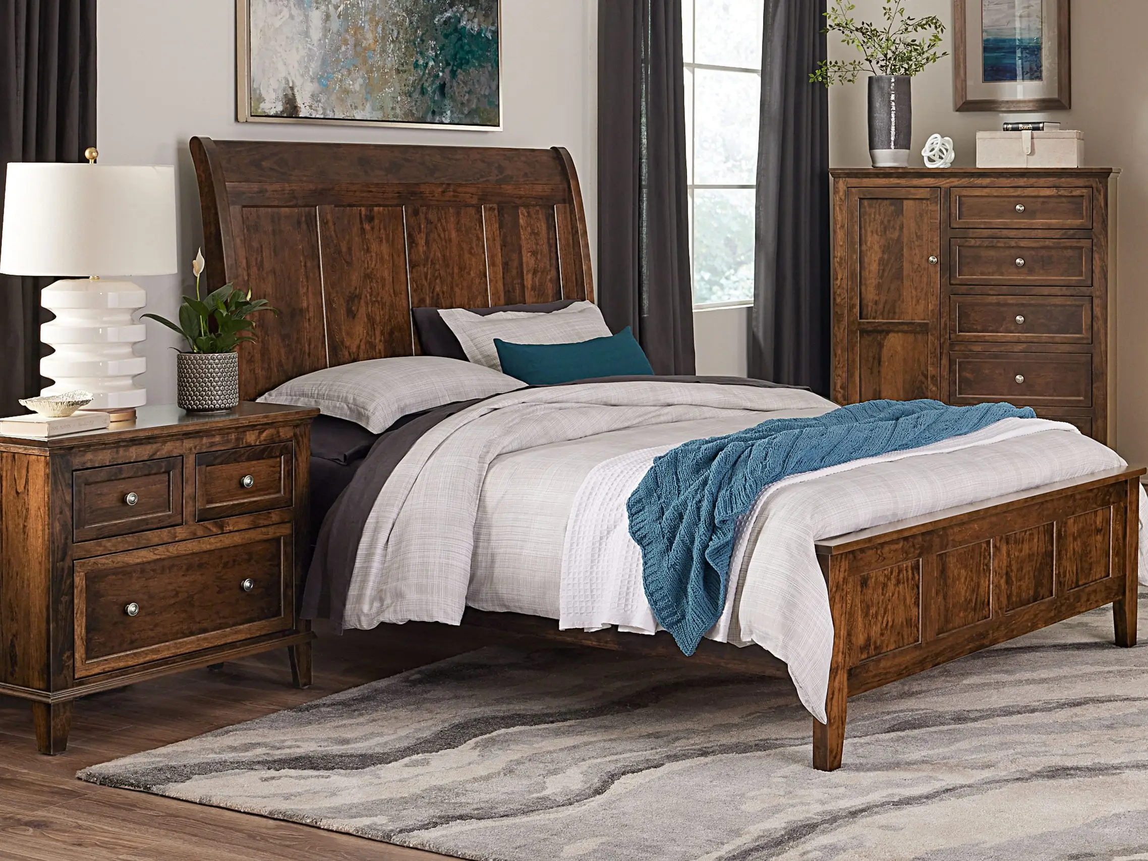 Rustic bedroom with wooden furniture and neutral bedding.