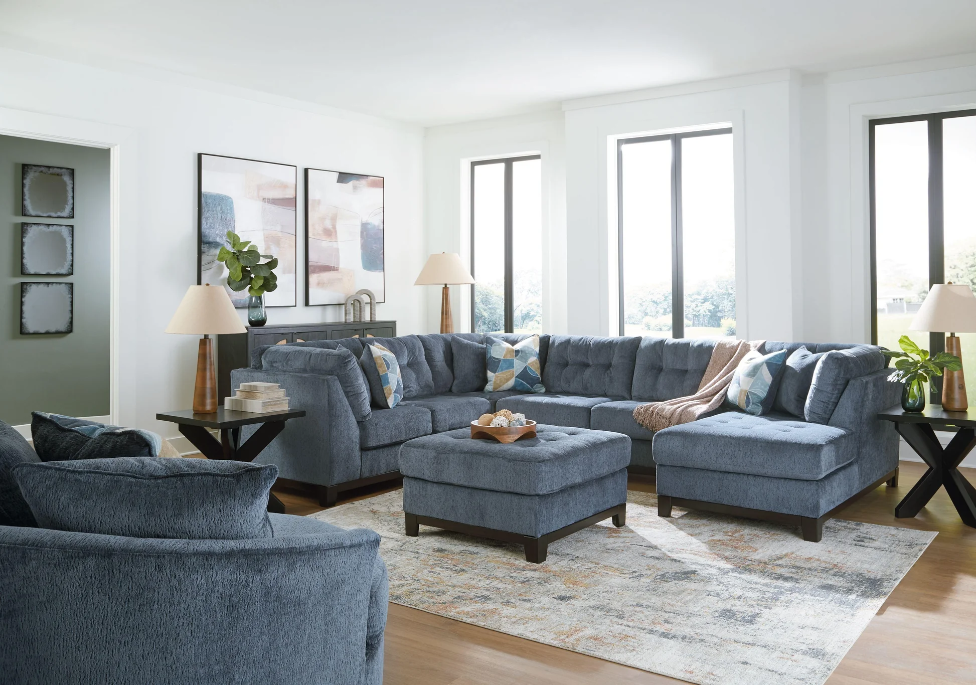 Modern living room with blue sectional sofa.