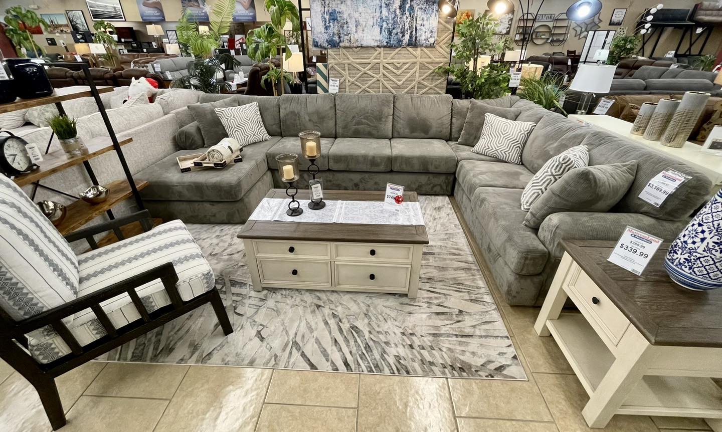 Modern gray sectional sofa in a furniture store.